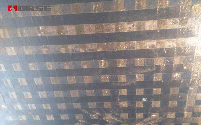 Carbon fiber fabric reinforcement for cracked floor slab