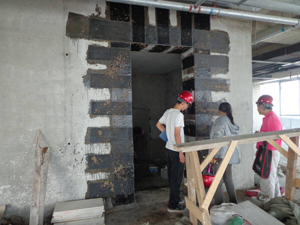 FRP Strengthening of Shear Walls with Openings